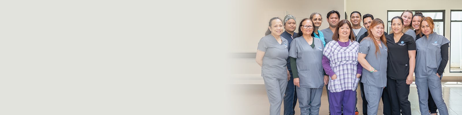 Several nurses standing in the hallway at Pacific Coast Post Acute