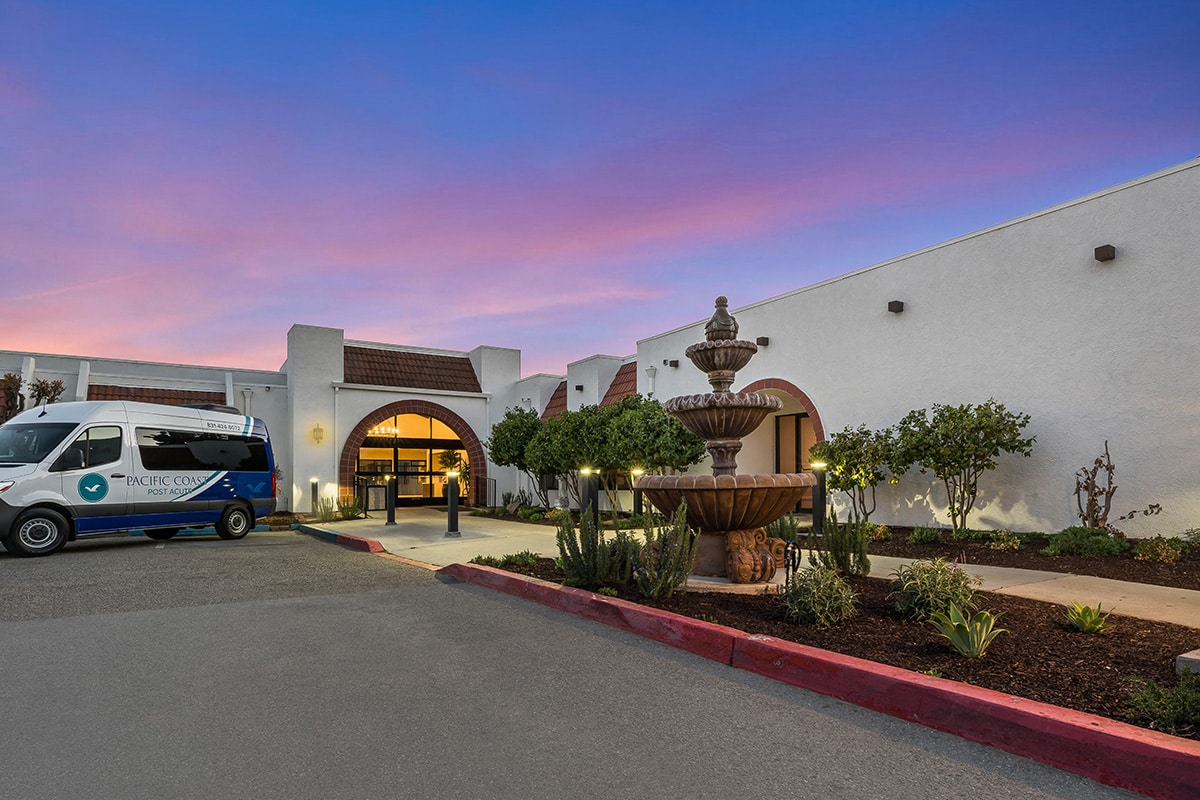 colorful sunset in front of the Pacific Coast facility